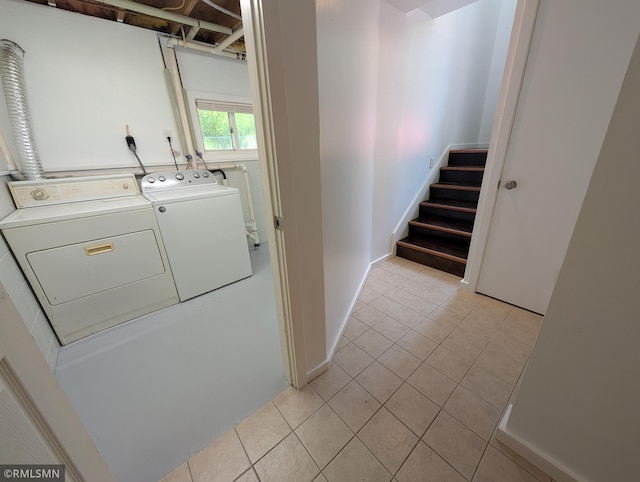 353 44th Ave NW, Powers Twp, MN 56435 - laundry room featuring washing machine and dryer, light tile patterned flooring, and baseboards