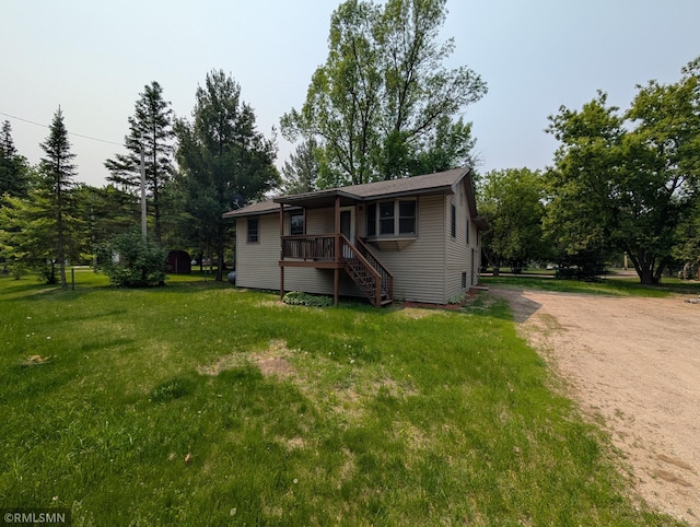 353 44th Ave NW, Powers Twp, MN 56435 - view of front of property with dirt driveway, a front lawn, and stairway