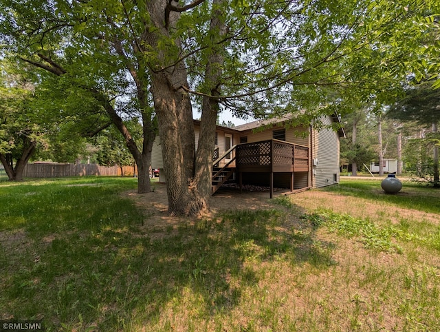 353 44th Ave NW, Powers Twp, MN 56435 - view of yard featuring a wooden deck and stairway