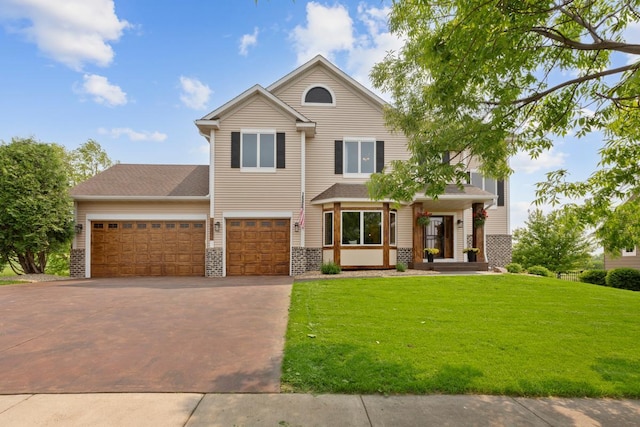 1900 Legacy Dr, Faribault, MN 55021 - view of front of home with driveway, a front yard, and a garage