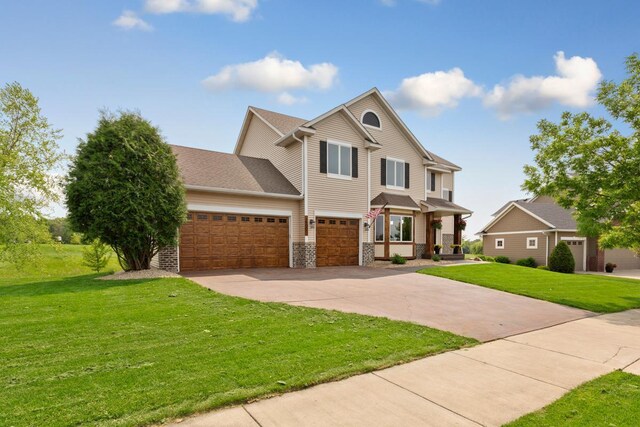 1900 Legacy Dr, Faribault, MN 55021 - view of front of property with driveway, a front lawn, and an attached garage
