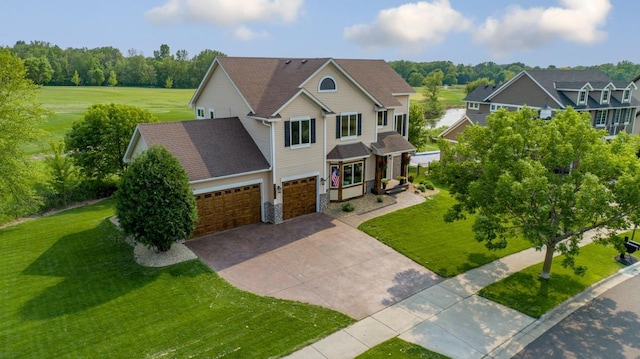 1900 Legacy Dr, Faribault, MN 55021 - view of front of home featuring driveway, a front yard, and a garage
