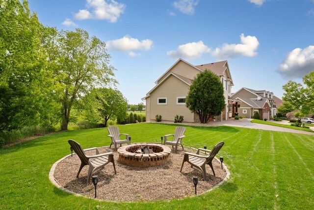 1900 Legacy Dr, Faribault, MN 55021 - view of green lawn featuring a fire pit