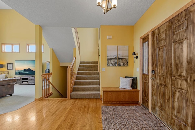 1900 Legacy Dr, Faribault, MN 55021 - entrance foyer with wood finished floors and stairs