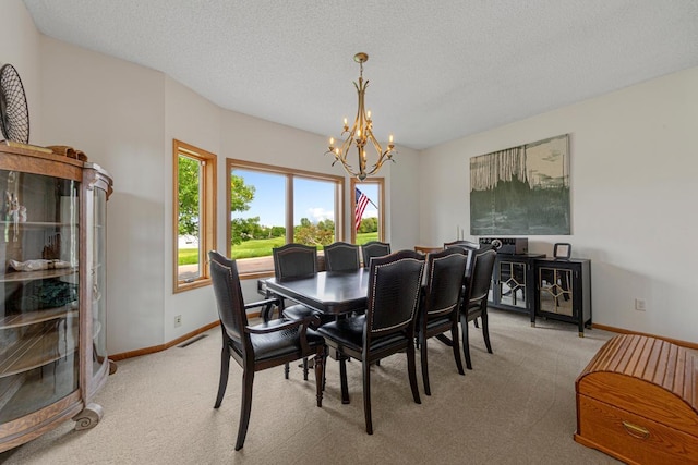 1900 Legacy Dr, Faribault, MN 55021 - dining room with light carpet, a chandelier, and baseboards