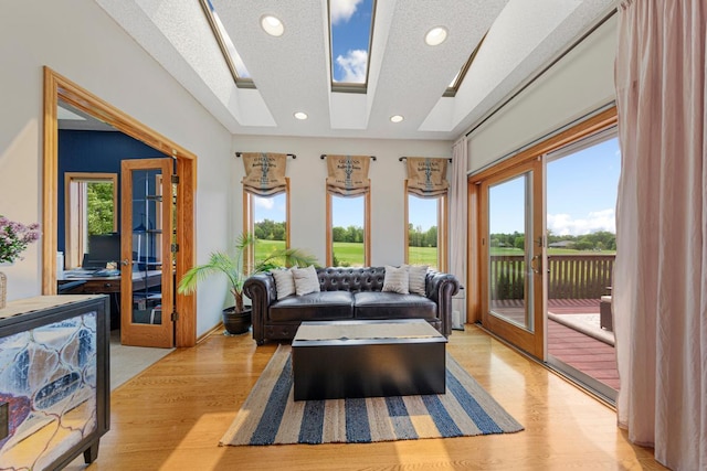 1900 Legacy Dr, Faribault, MN 55021 - living room featuring plenty of natural light, recessed lighting, light wood-style floors, and a textured ceiling