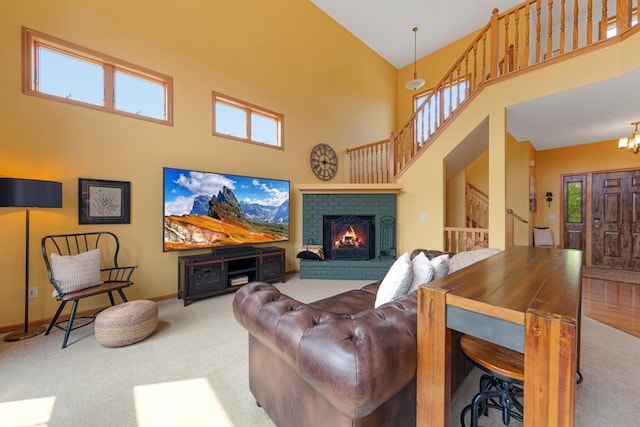 1900 Legacy Dr, Faribault, MN 55021 - living room featuring a high ceiling, carpet floors, stairs, baseboards, and plenty of natural light