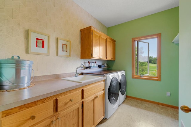 1900 Legacy Dr, Faribault, MN 55021 - laundry area with cabinet space, separate washer and dryer, and baseboards