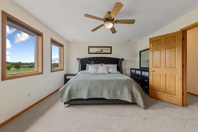 1900 Legacy Dr, Faribault, MN 55021 - bedroom with light colored carpet, a textured ceiling, ceiling fan, and baseboards