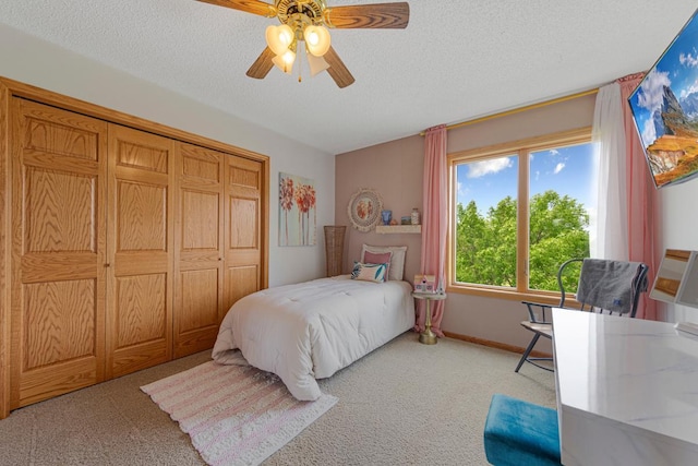 1900 Legacy Dr, Faribault, MN 55021 - bedroom with light carpet, a textured ceiling, ceiling fan, baseboards, and a closet