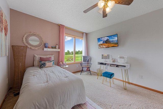 1900 Legacy Dr, Faribault, MN 55021 - carpeted bedroom with baseboards, a textured ceiling, and a ceiling fan