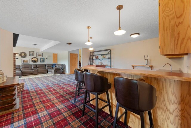 1900 Legacy Dr, Faribault, MN 55021 - indoor bar with a textured ceiling and hanging light fixtures