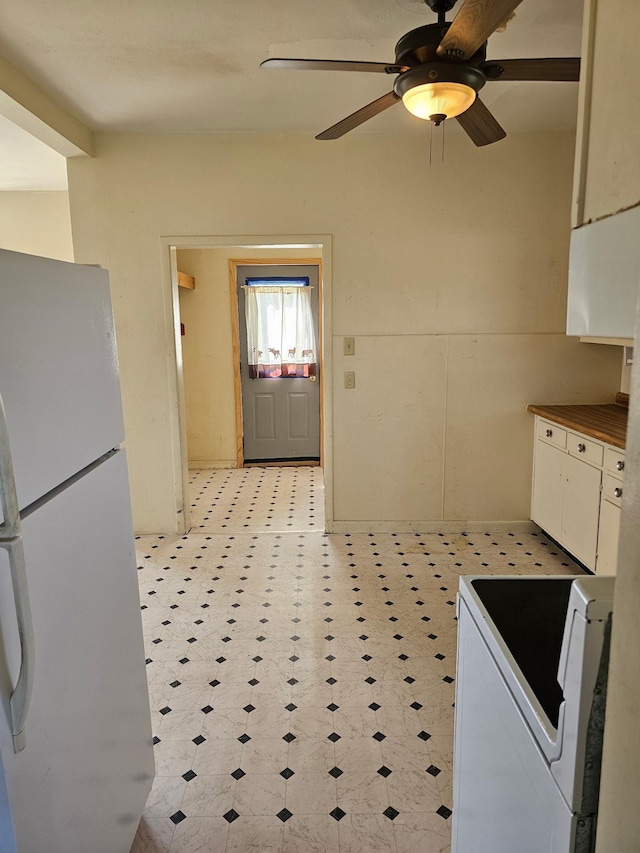 213 Harrison Ave N, Mentor, MN 56736 - kitchen featuring freestanding refrigerator, stove, light floors, and a ceiling fan