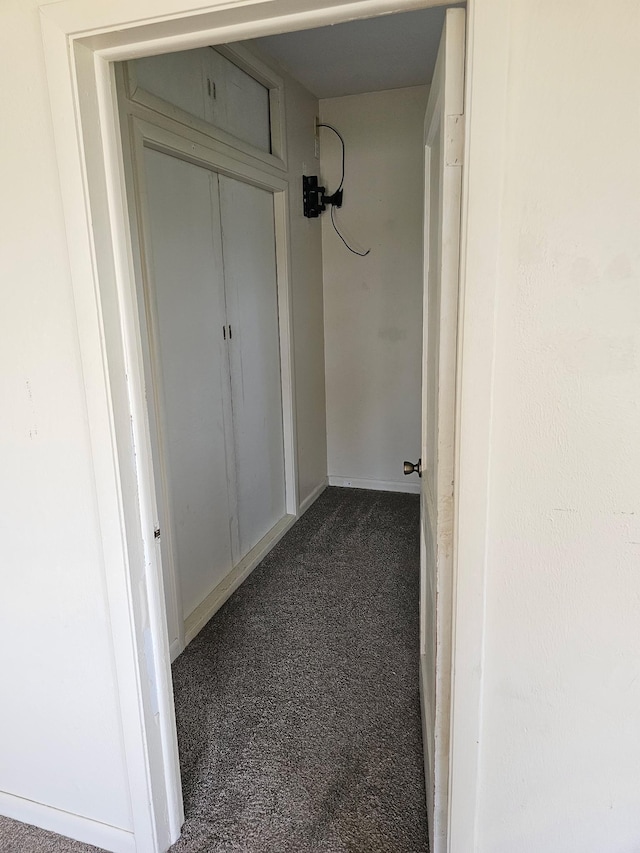 213 Harrison Ave N, Mentor, MN 56736 - hall featuring dark colored carpet and baseboards