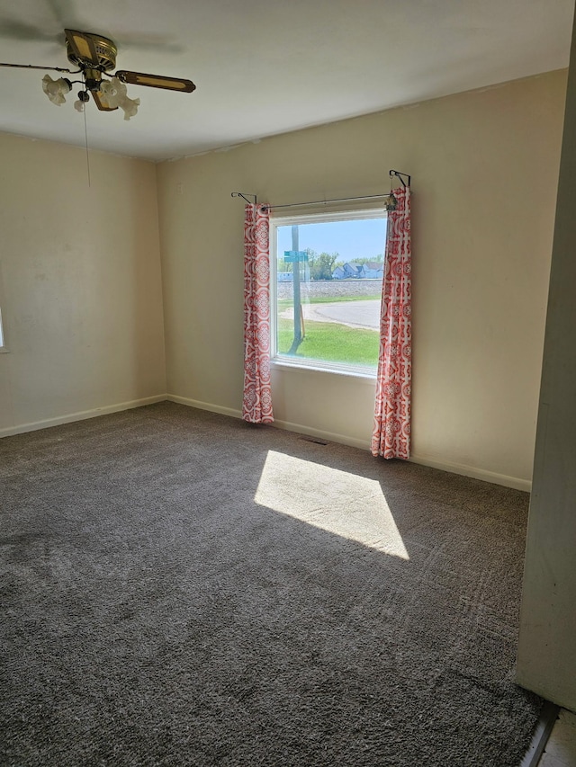 213 Harrison Ave N, Mentor, MN 56736 - spare room with carpet, a ceiling fan, and baseboards