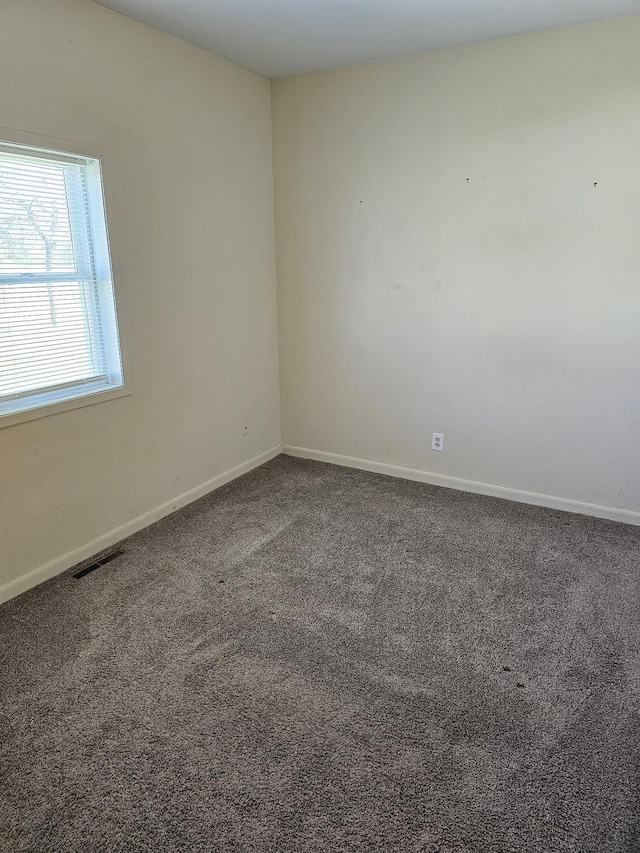 213 Harrison Ave N, Mentor, MN 56736 - carpeted empty room featuring baseboards