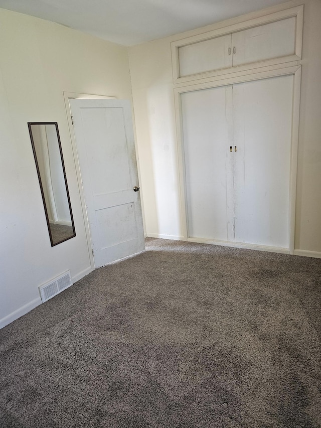 213 Harrison Ave N, Mentor, MN 56736 - unfurnished bedroom featuring carpet floors, baseboards, and a closet