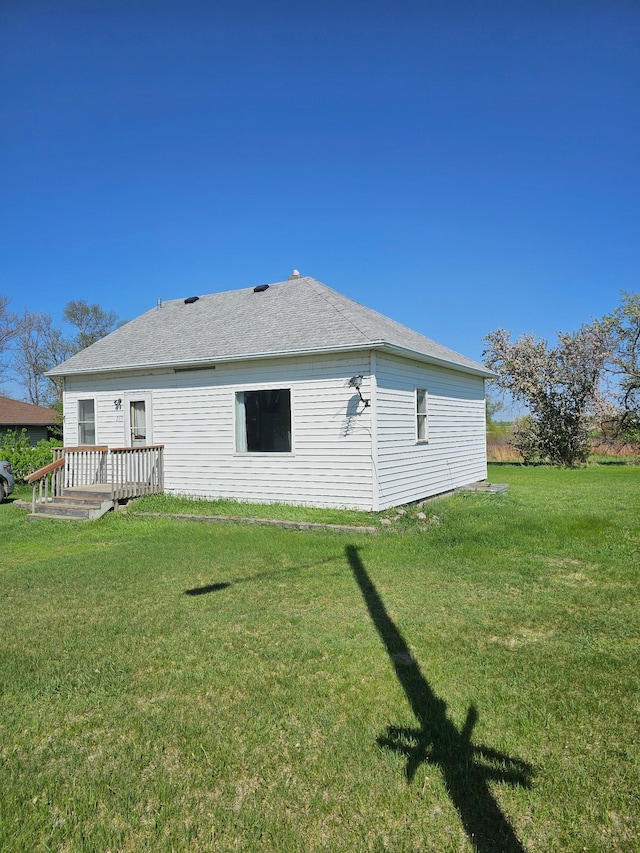 213 Harrison Ave N, Mentor, MN 56736 - rear view of house featuring a yard