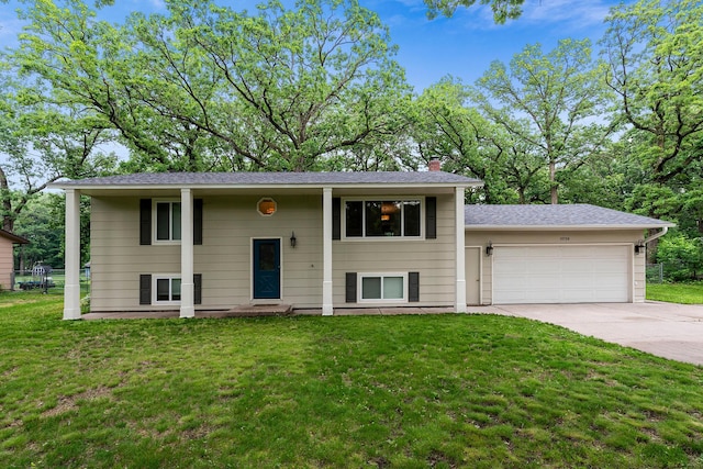 18799 147th St NW, Elk River, MN 55330 - bi-level home featuring concrete driveway, an attached garage, a chimney, and a front yard