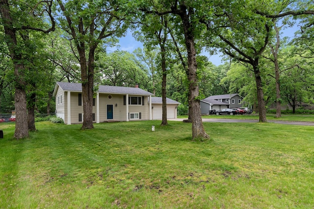 18799 147th St NW, Elk River, MN 55330 - raised ranch with a chimney, a front yard, and view of scattered trees