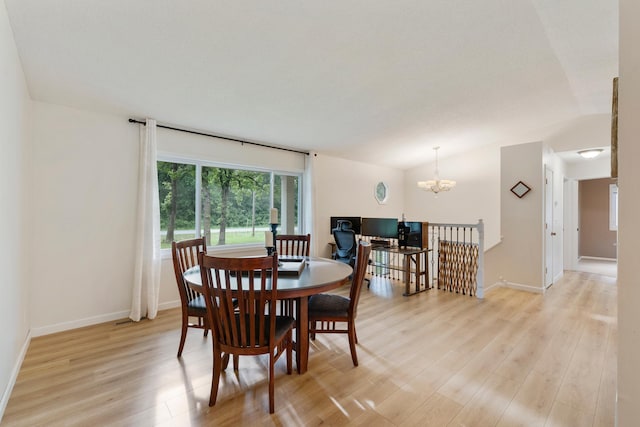 18799 147th St NW, Elk River, MN 55330 - dining space featuring light wood-type flooring, a chandelier, vaulted ceiling, and baseboards