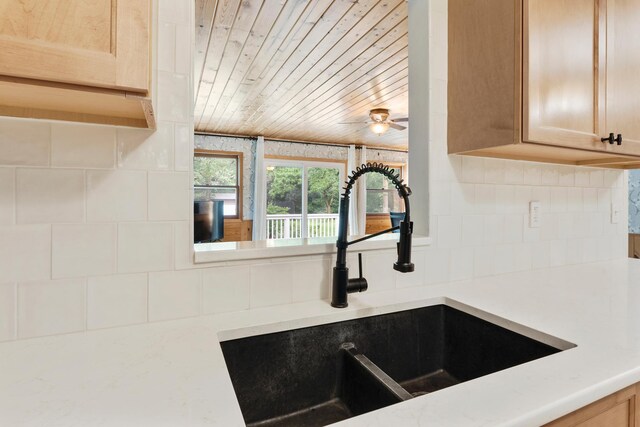 18799 147th St NW, Elk River, MN 55330 - kitchen view of a sink, wooden ceiling, backsplash, and a ceiling fan