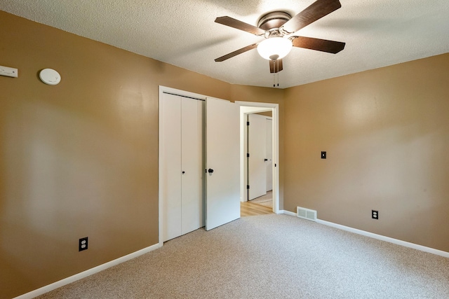 18799 147th St NW, Elk River, MN 55330 - unfurnished bedroom featuring light colored carpet, a closet, baseboards, and ceiling fan