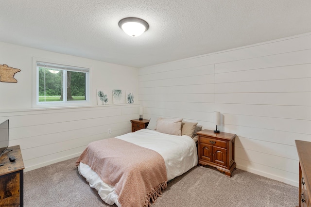 18799 147th St NW, Elk River, MN 55330 - bedroom with light colored carpet, a textured ceiling, and wood walls