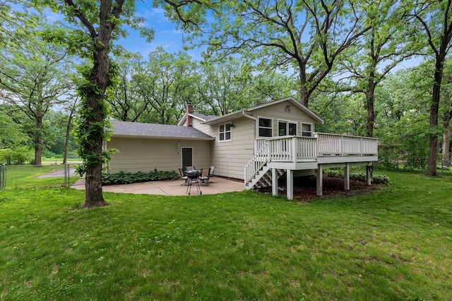 18799 147th St NW, Elk River, MN 55330 - rear view of house with a deck, a patio area, and a chimney