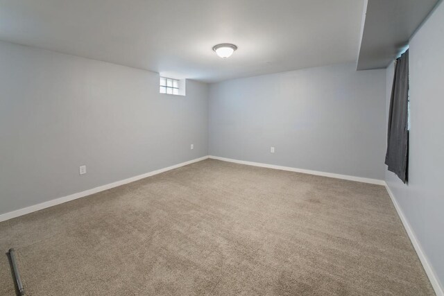 724 1st Ave NW, New Brighton, MN 55112 - below grade area featuring carpet floors and baseboards