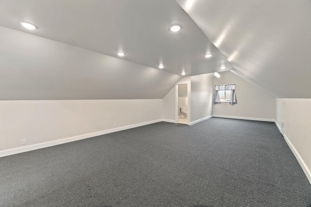 724 1st Ave NW, New Brighton, MN 55112 - additional living space with baseboards, lofted ceiling, dark colored carpet, and recessed lighting