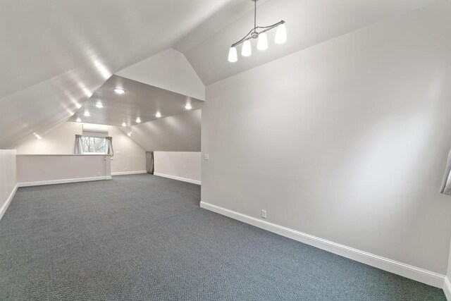 724 1st Ave NW, New Brighton, MN 55112 - bonus room featuring baseboards, lofted ceiling, and dark carpet