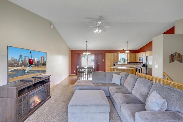 12966 Carole Dr, Becker, MN 55308 - living area featuring lofted ceiling, ceiling fan, and light carpet