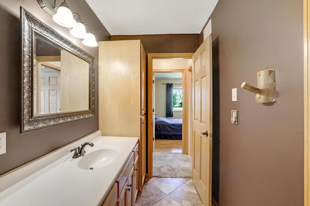 12966 Carole Dr, Becker, MN 55308 - bathroom with vanity, tile patterned floors, and ensuite bathroom