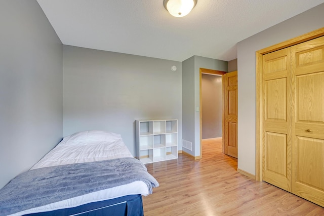 12966 Carole Dr, Becker, MN 55308 - bedroom featuring light wood-style flooring and a closet