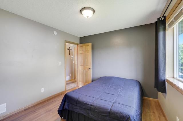 12966 Carole Dr, Becker, MN 55308 - bedroom featuring light wood-style flooring and baseboards