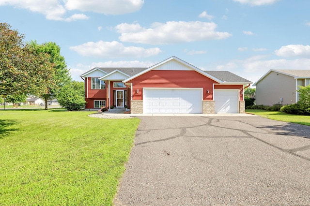12966 Carole Dr, Becker, MN 55308 - view of front of property with a front lawn, asphalt driveway, a garage, and brick siding