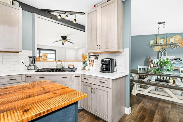 2541 County Road 4, Carlton, MN 55718 - kitchen with gas cooktop, a ceiling fan, backsplash, and dark wood-style floors