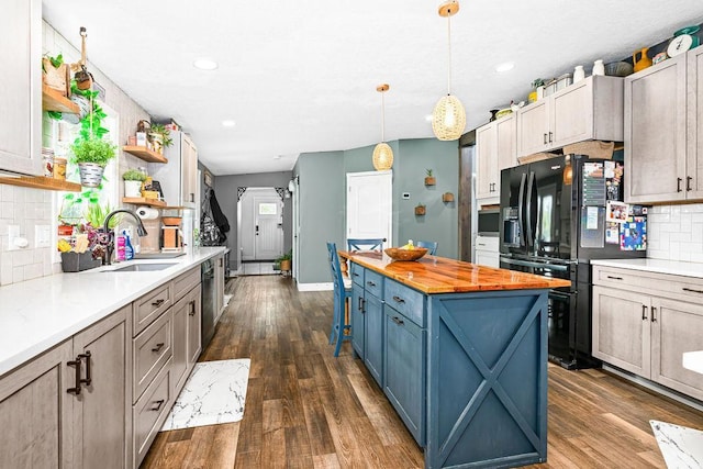 2541 County Road 4, Carlton, MN 55718 - kitchen featuring a sink, black refrigerator with ice dispenser, open shelves, wood counters, and decorative backsplash