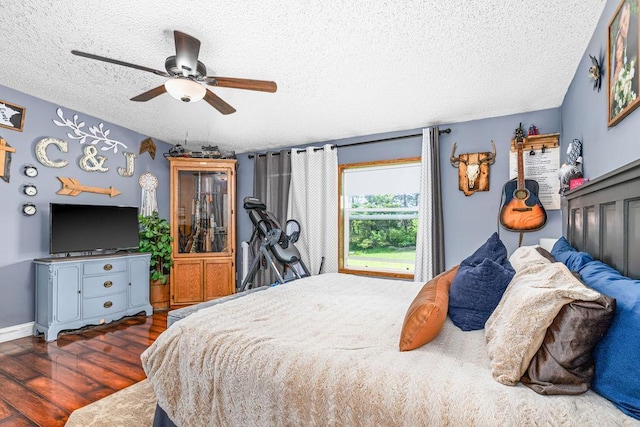 2541 County Road 4, Carlton, MN 55718 - bedroom with a textured ceiling, wood finished floors, and a ceiling fan