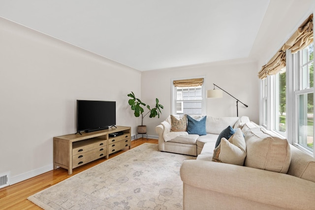 5737 Vincent Ave S, Minneapolis, MN 55410 - living room with wood finished floors, plenty of natural light, and baseboards