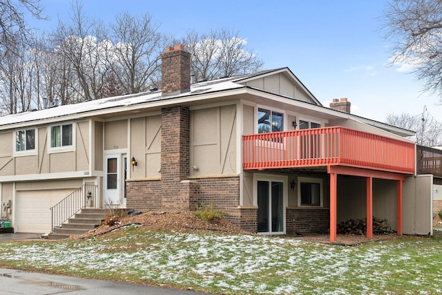 7511 Zinnia Way, Maple Grove, MN 55311 - view of front facade with a chimney, brick siding, an attached garage, and a wooden deck
