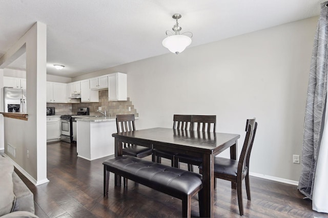 7511 Zinnia Way, Maple Grove, MN 55311 - dining space featuring dark wood-style flooring and baseboards