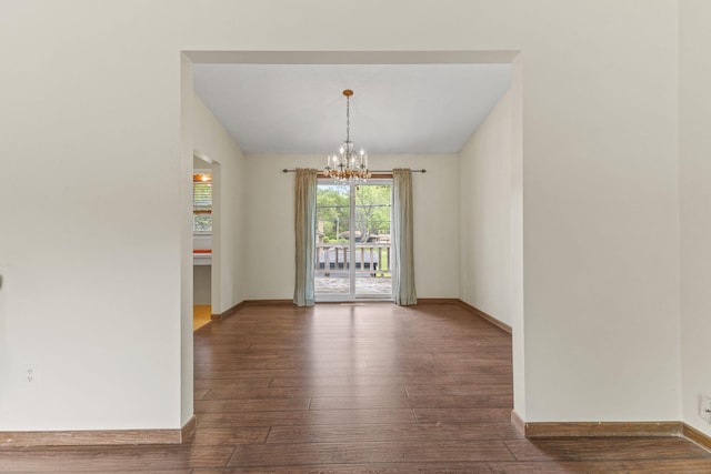 3932 Louisiana Ave N, New Hope, MN 55427 - empty room with wood-type flooring, a chandelier, and baseboards