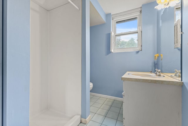 3932 Louisiana Ave N, New Hope, MN 55427 - full bath with a stall shower, toilet, vanity, and baseboards