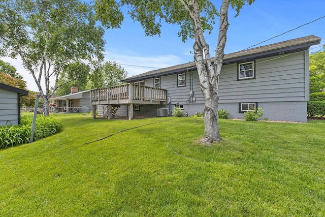 3932 Louisiana Ave N, New Hope, MN 55427 - rear view of property featuring a wooden deck, a yard, and central air condition unit