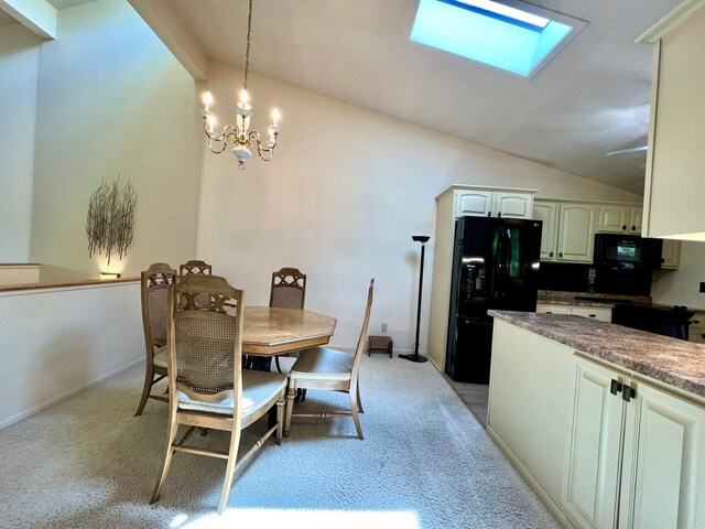 1319 3rd St, Red Wing, MN 55066 - dining room with lofted ceiling, light carpet, a chandelier, and a skylight