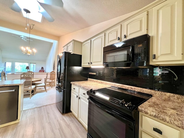 1319 3rd St, Red Wing, MN 55066 - kitchen with black appliances, a ceiling fan, light wood-style floors, backsplash, and hanging light fixtures