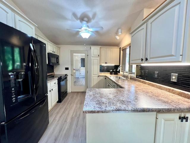 1319 3rd St, Red Wing, MN 55066 - kitchen with black appliances, a sink, a peninsula, light wood-style floors, and a ceiling fan