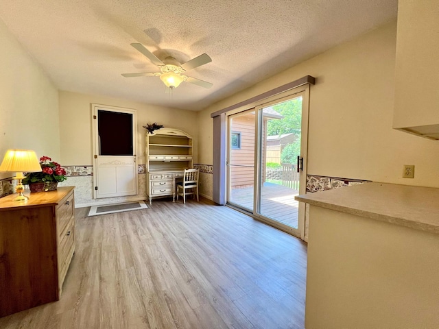1319 3rd St, Red Wing, MN 55066 - interior space with wood finished floors, a ceiling fan, and a textured ceiling